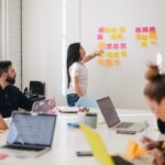 Employees meet in a conference room to cover drug-free workplace policy